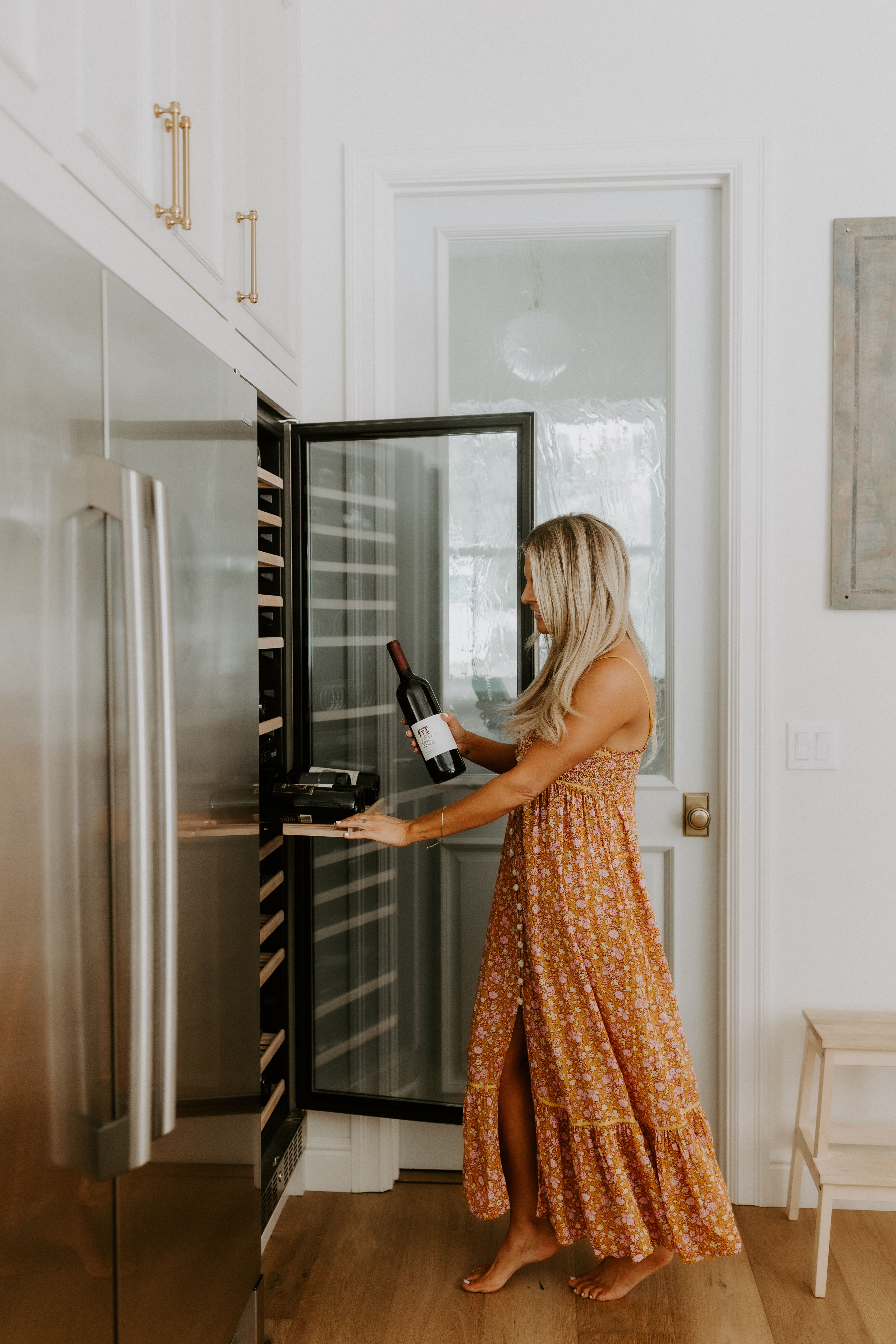 A women putting wine into her cellar